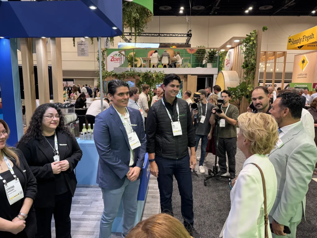 Visitors at the SiCar Farms booth during IFPA 2026